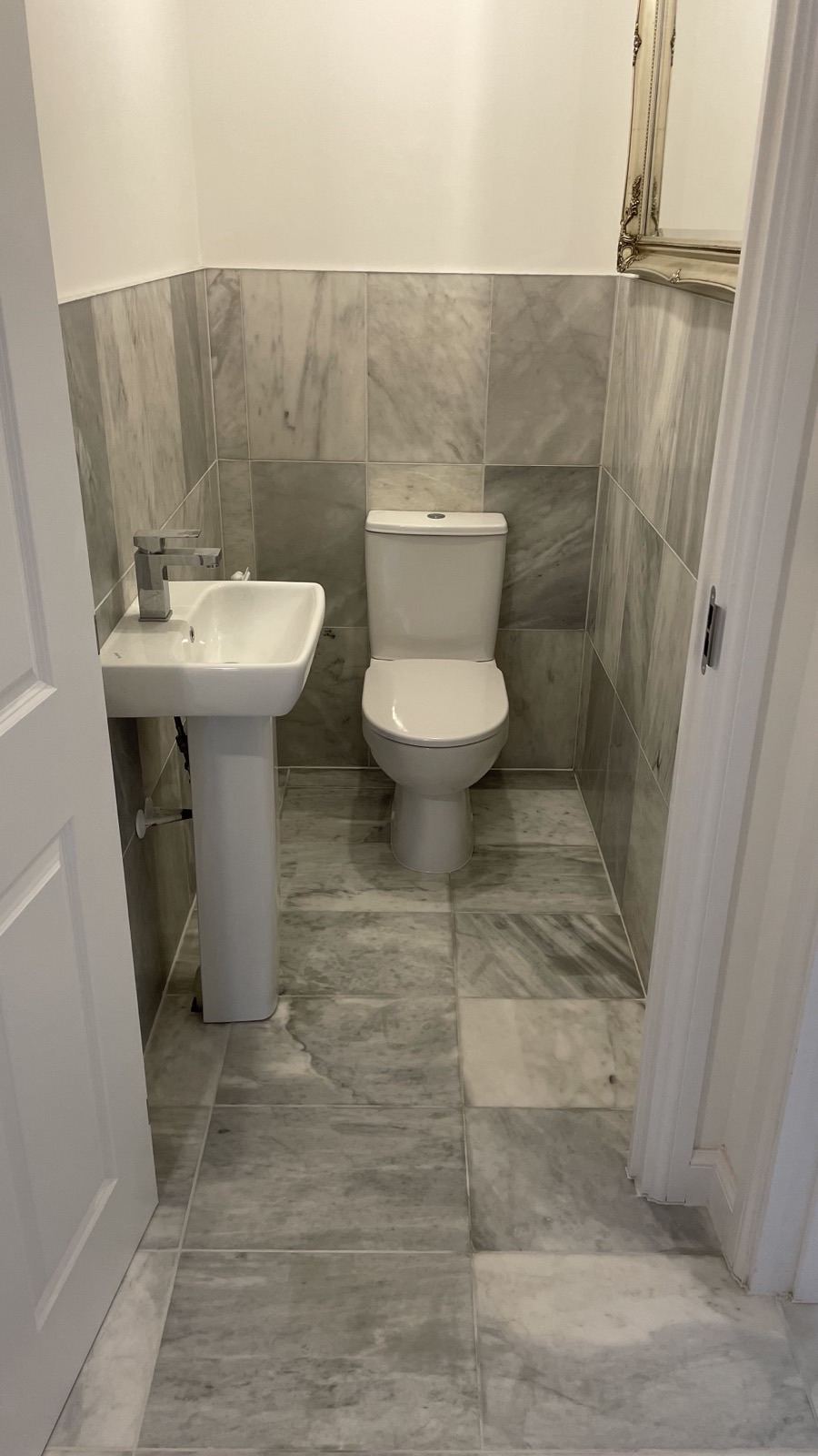 Cloakroom with natural stone floor tiles
