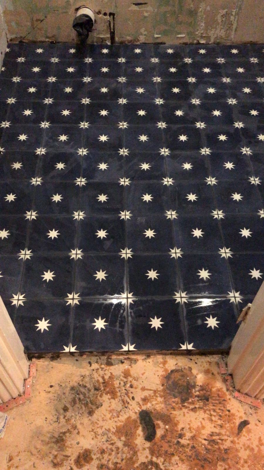 Navy and white star-pattern floor tiles